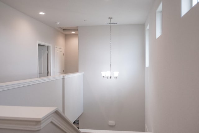 interior space with plenty of natural light and a notable chandelier