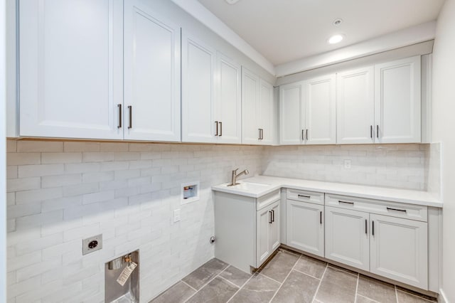 washroom featuring washer hookup, recessed lighting, cabinet space, a sink, and electric dryer hookup