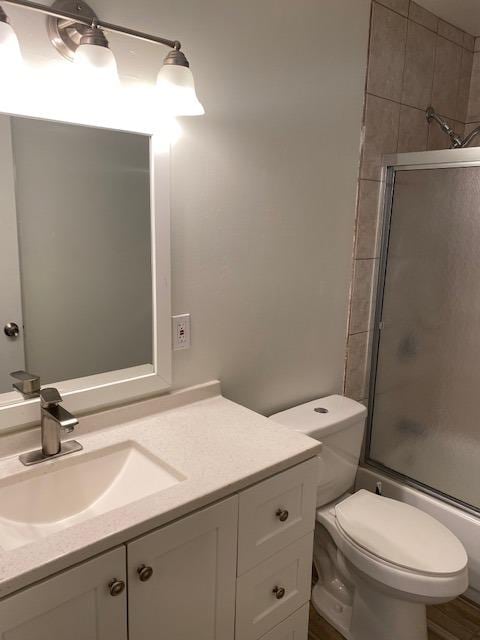 bathroom featuring large vanity and toilet