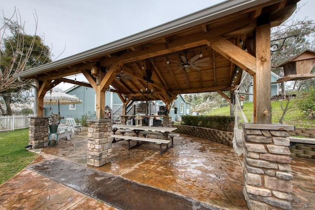 view of property's community with a patio, a yard, and fence
