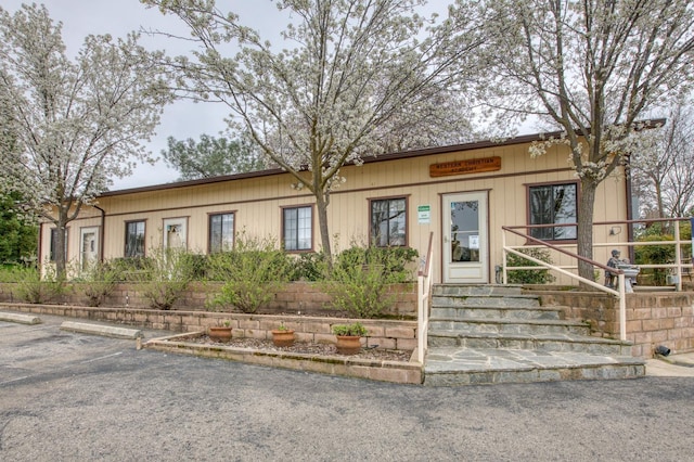 view of front of property featuring uncovered parking