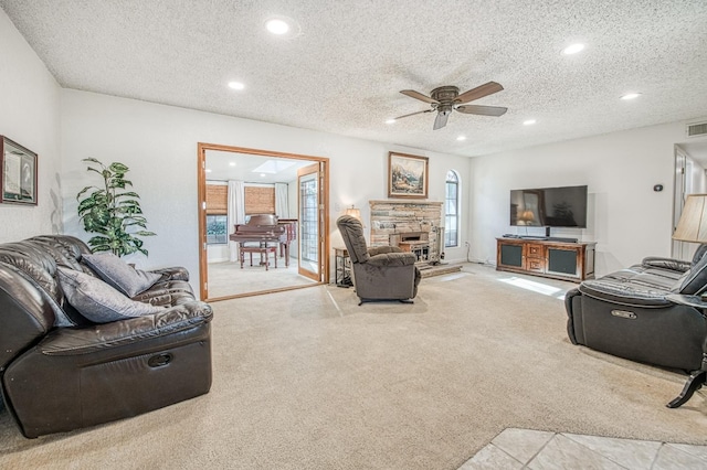 living area featuring recessed lighting, carpet floors, and a ceiling fan