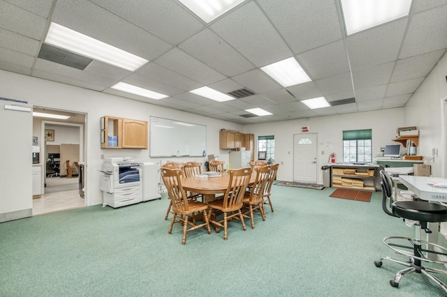 dining room with visible vents, a paneled ceiling, and light colored carpet