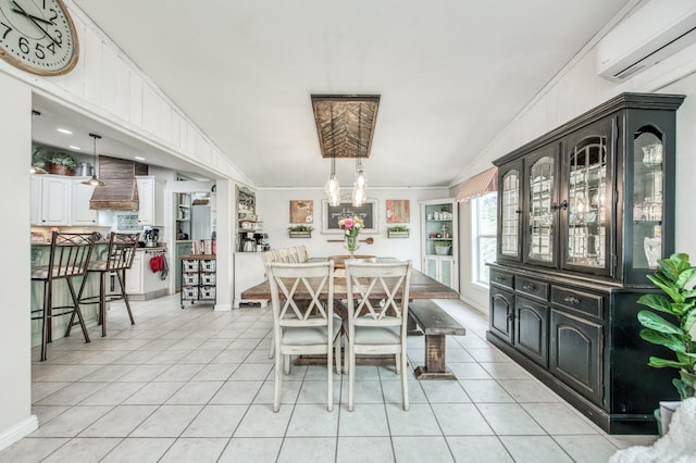 dining space featuring light tile patterned floors, an AC wall unit, a chandelier, and crown molding