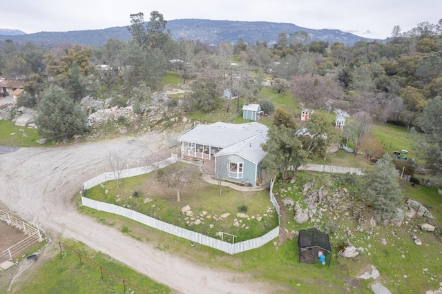 birds eye view of property featuring a mountain view