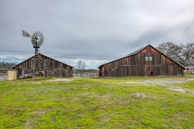 view of yard with a barn and an outdoor structure