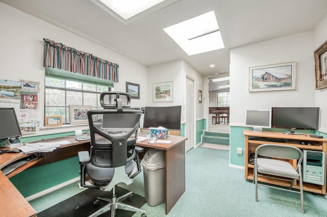 office area with a skylight and carpet flooring