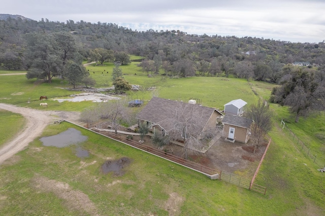 drone / aerial view with a rural view and a forest view