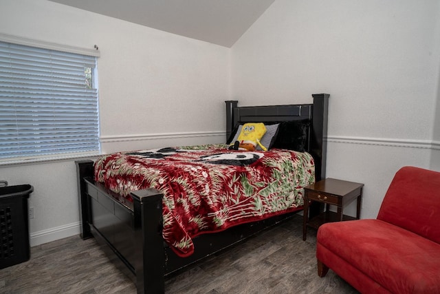 bedroom featuring dark hardwood / wood-style floors and vaulted ceiling