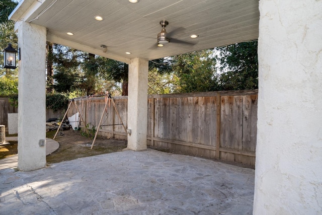 view of patio with ceiling fan and central AC unit