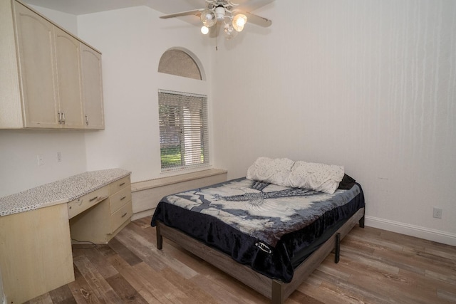 bedroom featuring ceiling fan and wood-type flooring