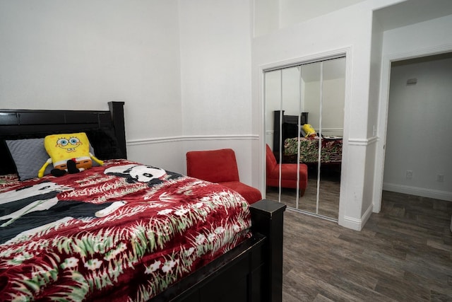 bedroom featuring a closet and dark hardwood / wood-style floors