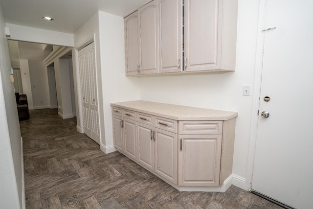 hall featuring dark parquet floors