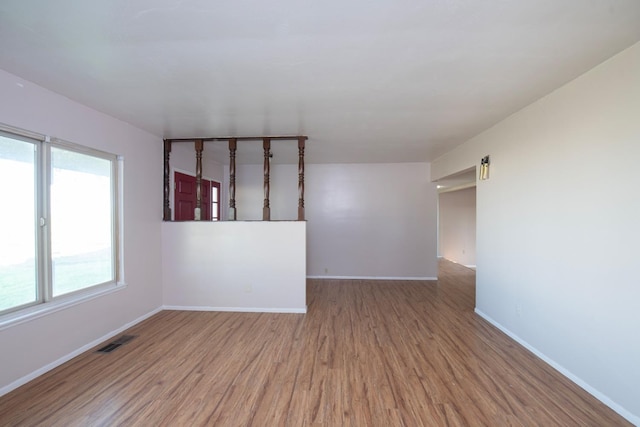 unfurnished room featuring wood-type flooring