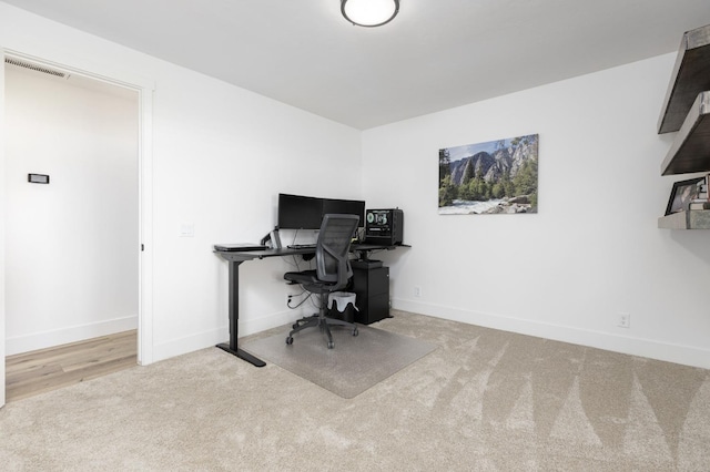 office space with light colored carpet