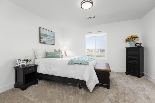 bedroom with light carpet