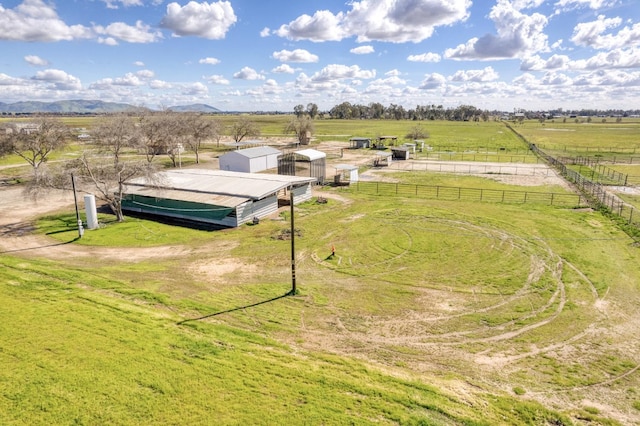 birds eye view of property with a rural view