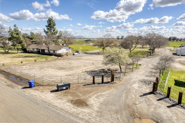 birds eye view of property with a rural view