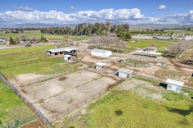 drone / aerial view featuring a mountain view and a rural view