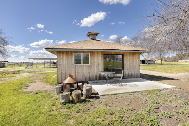 back of house with a patio area