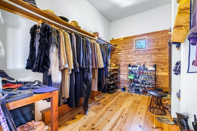 spacious closet with light hardwood / wood-style floors