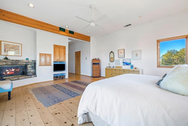 bedroom with light hardwood / wood-style floors and ceiling fan