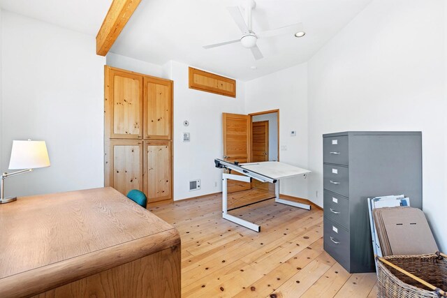 bedroom with beam ceiling, ceiling fan, and light wood-type flooring