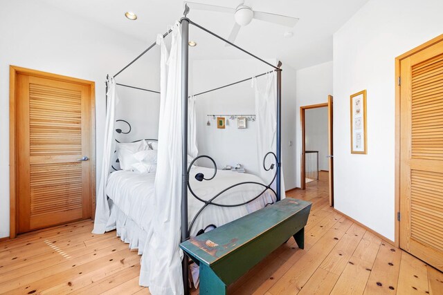 bedroom with light hardwood / wood-style flooring and ceiling fan