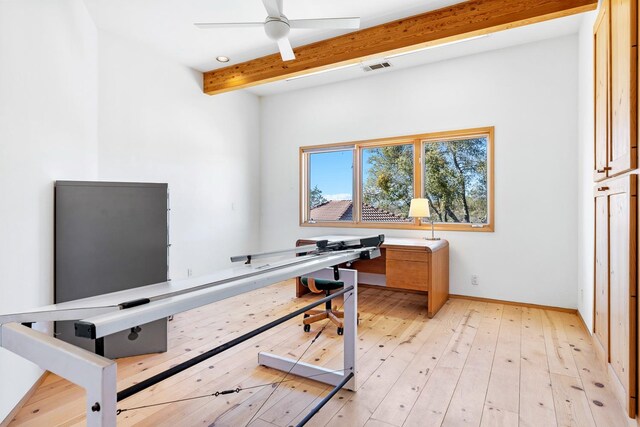 office space featuring light hardwood / wood-style floors, beam ceiling, and ceiling fan