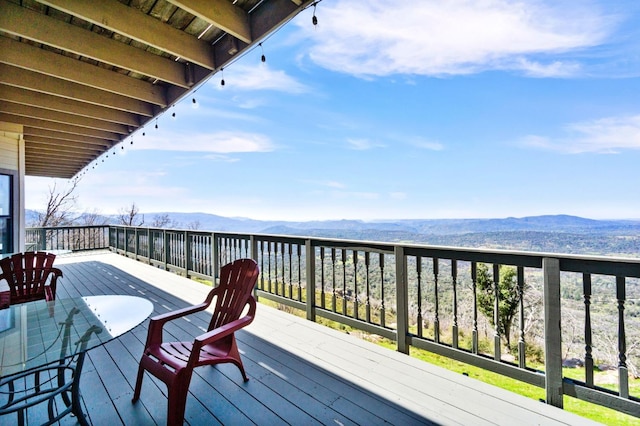 wooden terrace featuring a mountain view