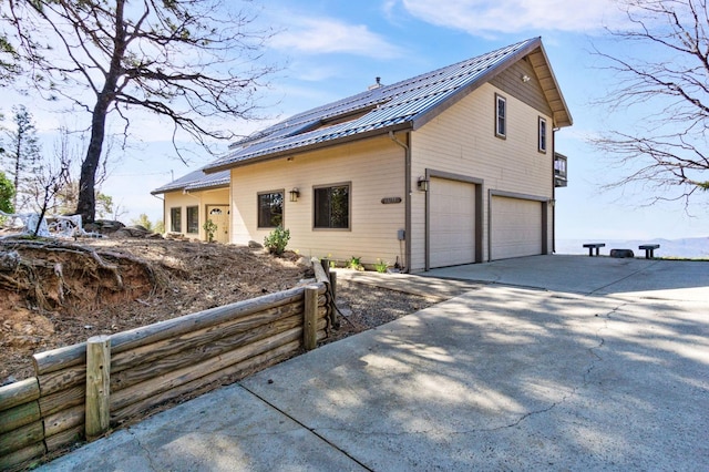 view of side of property featuring a garage