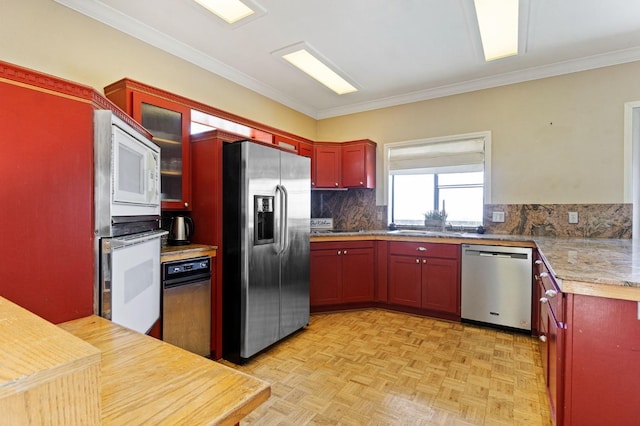 kitchen featuring light parquet flooring, tasteful backsplash, stainless steel appliances, and crown molding