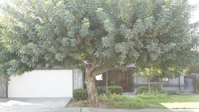 obstructed view of property featuring a garage