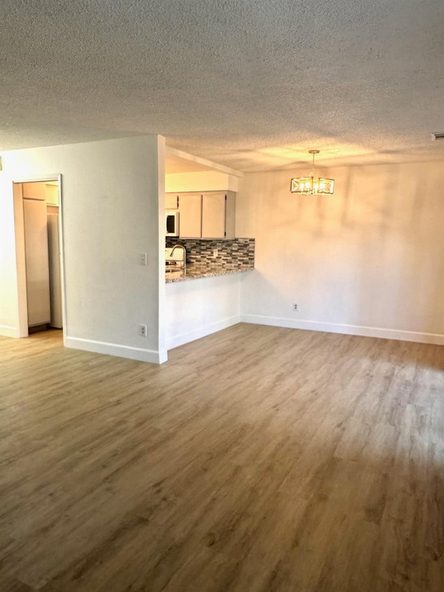 unfurnished living room featuring light wood-type flooring