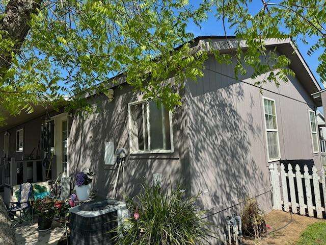 view of property exterior with cooling unit