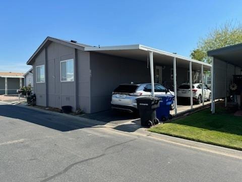 view of side of property featuring a carport