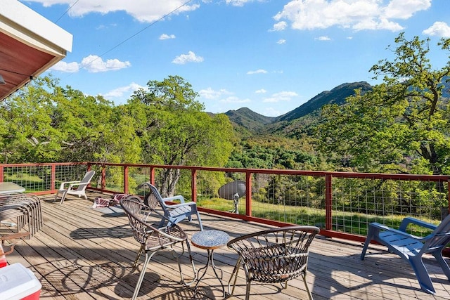 wooden terrace featuring a mountain view