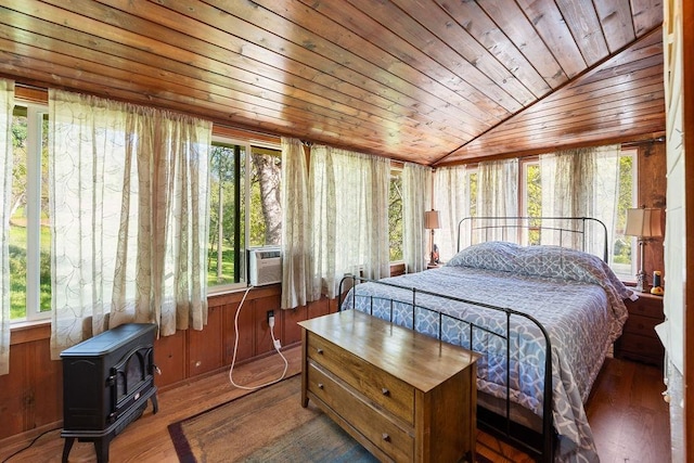 bedroom with wooden ceiling, multiple windows, and dark hardwood / wood-style floors