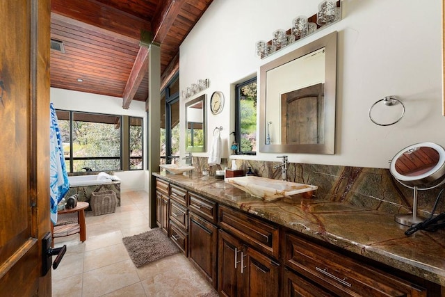 bathroom with beamed ceiling, wooden ceiling, tile floors, and dual bowl vanity