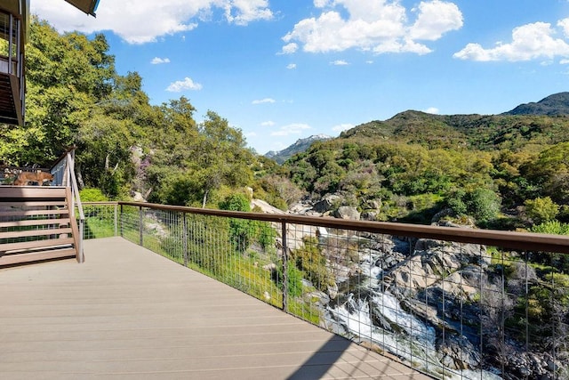 wooden deck with a mountain view