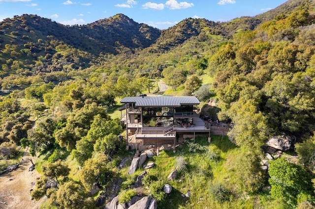 birds eye view of property with a mountain view