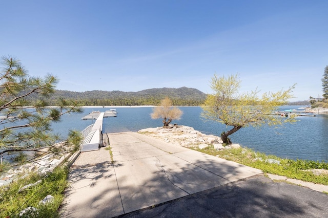 property view of water featuring a boat dock