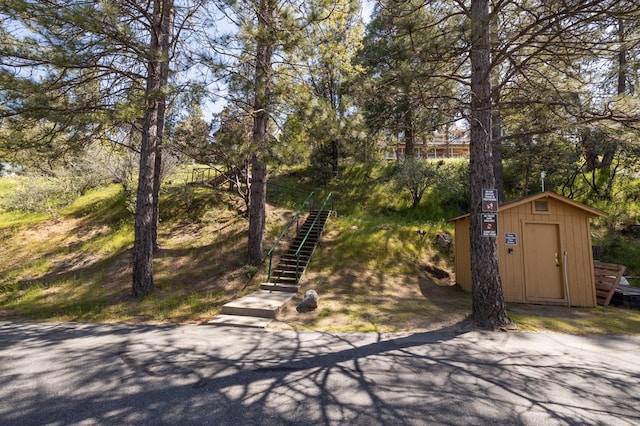 view of front facade featuring a storage shed