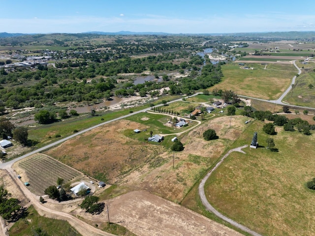 birds eye view of property with a rural view