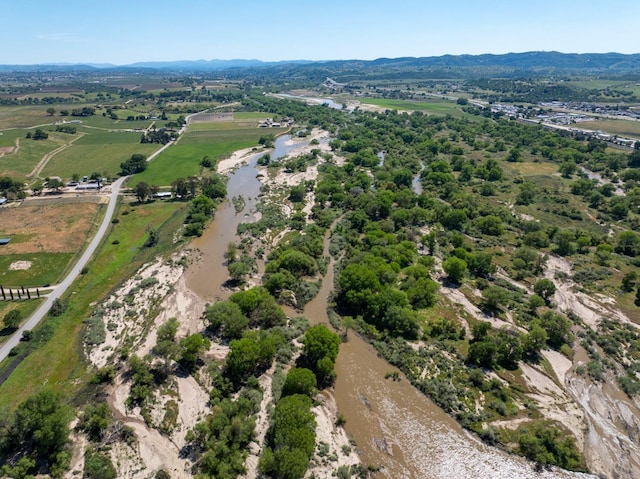 drone / aerial view with a mountain view and a rural view