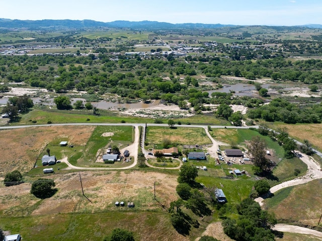 drone / aerial view featuring a mountain view