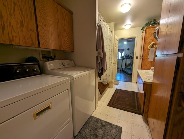 laundry area featuring washer and dryer and light floors