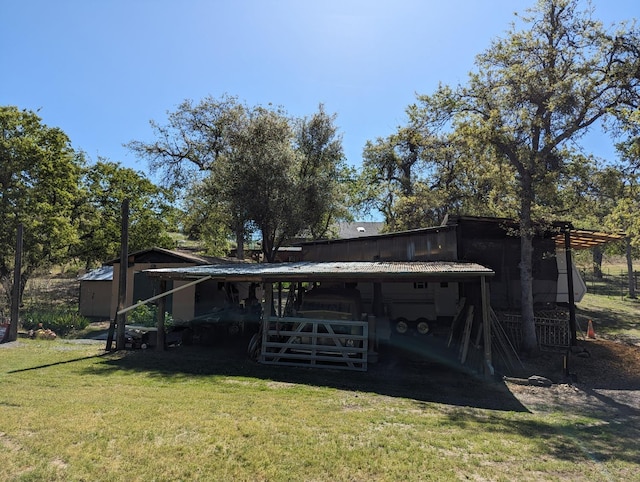 view of outdoor structure with an attached carport