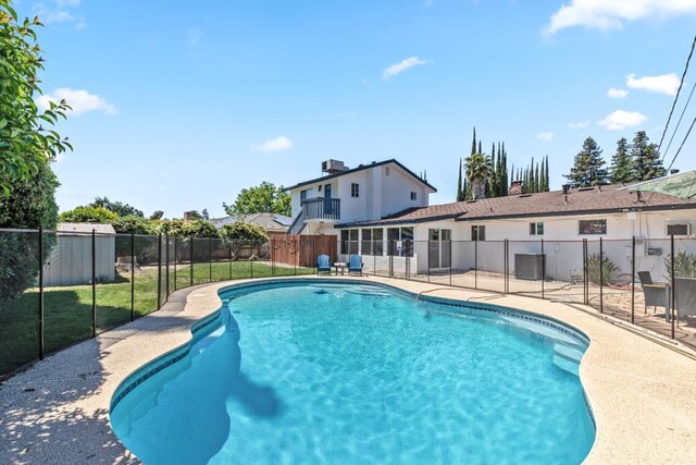 925 S Purdue Ave, Fresno, CA 93727 - view of pool with a fenced backyard, central AC unit, and a patio area