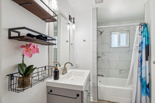 925 S Purdue Ave, Fresno, CA 93727 - bathroom featuring vanity and shower / bath combo with shower curtain